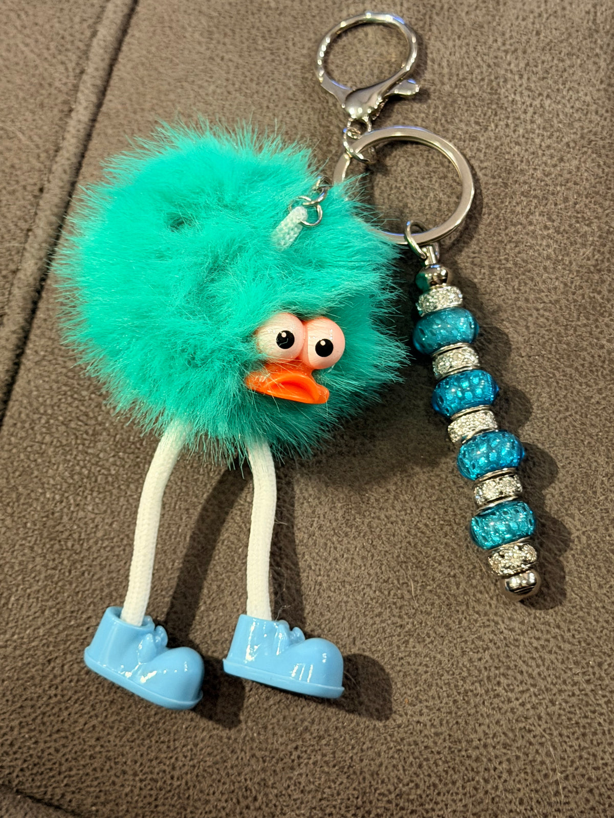 Goofy Long-Legged Teal Monster Pom-Pom Keychain