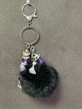 Chic Black Pom-Pom Keychain with Purple Crystal Accents